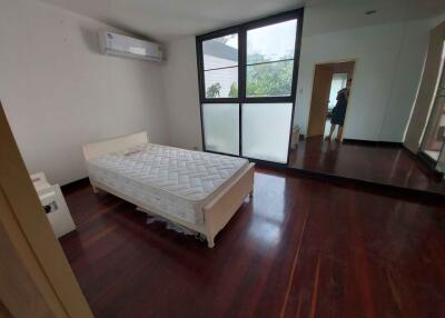 Bedroom with a bed and large windows