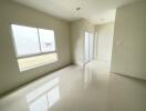 Spacious unfurnished bedroom with large window