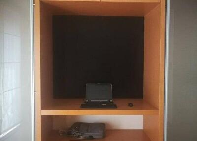 Built-in desk unit with laptop and storage space