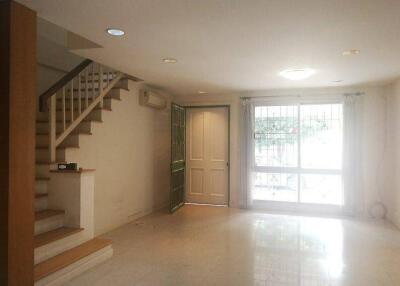 Spacious living room with access to stairs