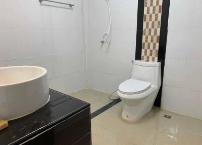 Modern bathroom with toilet and sink