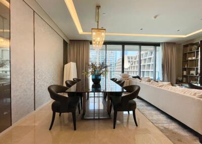 Modern living room with dining area and large windows