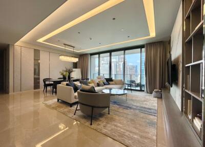 Spacious modern living room with a city view, contemporary furniture, and elegant lighting