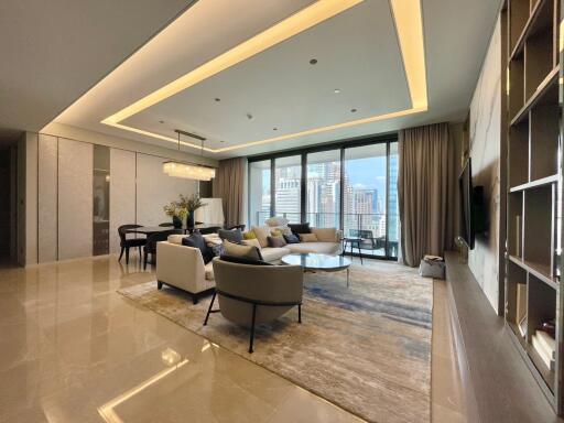 Spacious modern living room with a city view, contemporary furniture, and elegant lighting