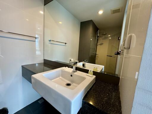 Modern bathroom with large mirror and sink