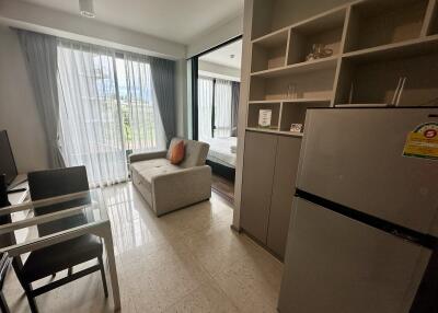 Modern living room with a small kitchen area