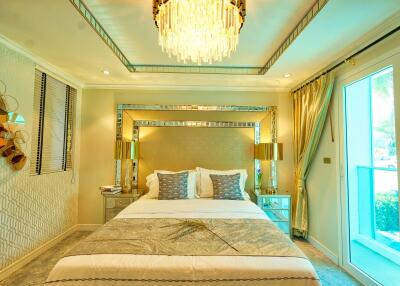 Luxury bedroom with ornate chandelier and large bed