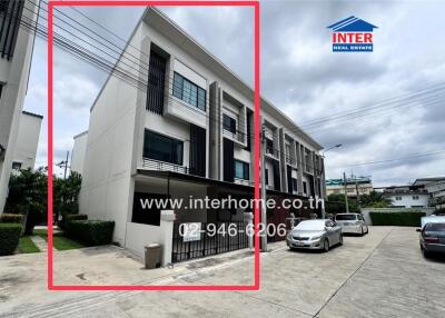 Front view of a modern townhouse with three floors