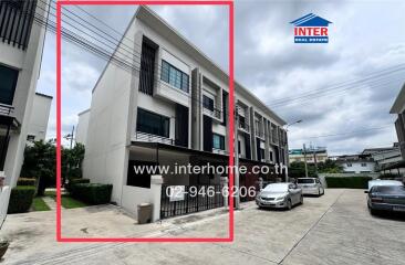 Front view of a modern townhouse with three floors