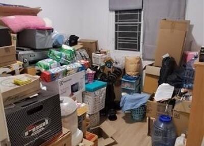 Room used as storage space with various items and boxes