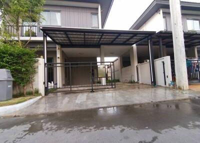 Two-story house with a carport