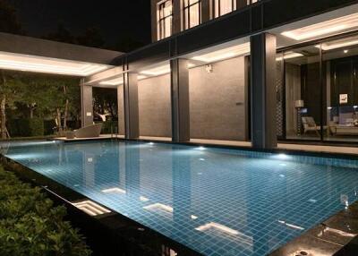 Outdoor pool area with night lighting