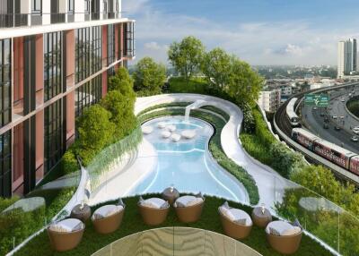 Outdoor pool area in a modern building with city view