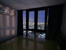 Bedroom at night with city view