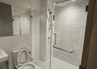 Modern bathroom with glass shower and toilet