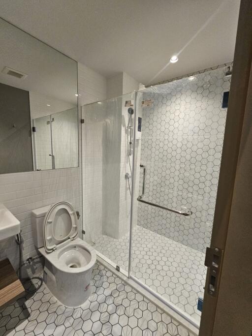 Modern bathroom with glass shower and toilet