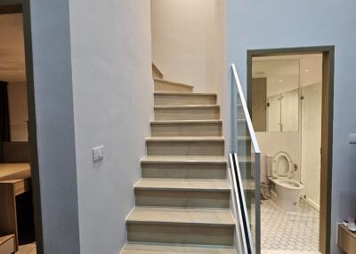 Stairway with a view of the bathroom