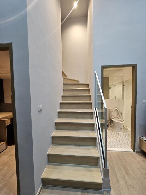 Stairway with a view of the bathroom