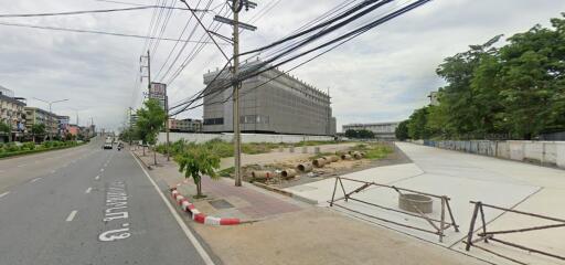 Road view with building and construction site