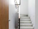 Modern indoor staircase with wooden handrails