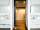 Modern bathroom with dual sinks and walk-in closet