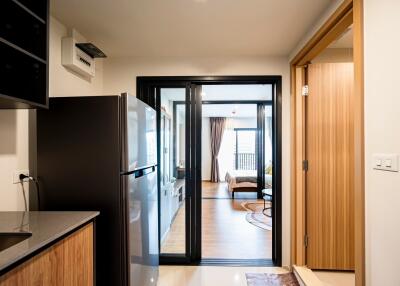 View of kitchen and living area with sliding glass door