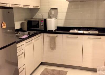 Modern kitchen with stainless steel appliances and sleek cabinetry