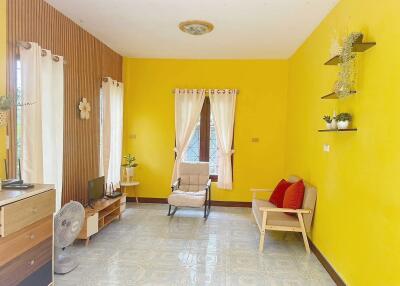 Bright living room with yellow walls and minimalistic decor