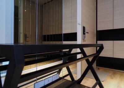 Modern hallway with a console table and mirrored wall