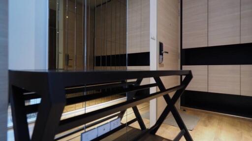 Modern hallway with a console table and mirrored wall