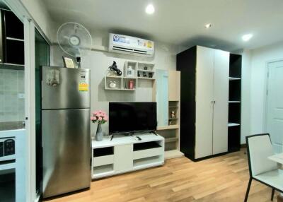 Modern living area with appliances and storage