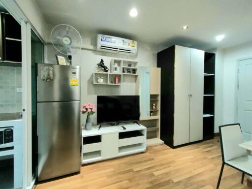 Modern living area with appliances and storage