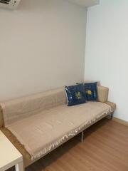 Minimalist living room with beige sofa and decorative pillows