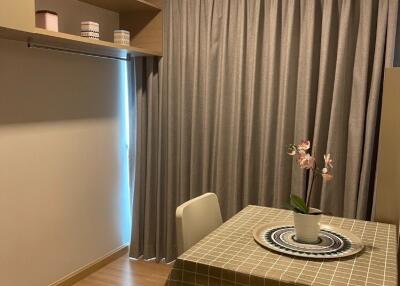 Cozy dining area with a table and built-in shelving