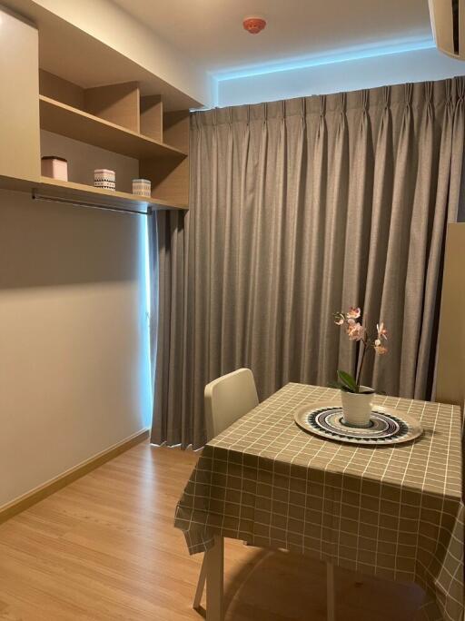 Cozy dining area with a table and built-in shelving