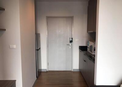 Apartment entrance with kitchen area