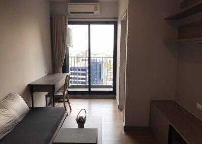 Living room with a balcony view and furniture