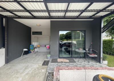 Covered outdoor area with seating and storage space