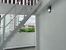 Staircase leading to upper structure with view of surrounding buildings