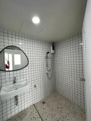 Bathroom with shower and sink