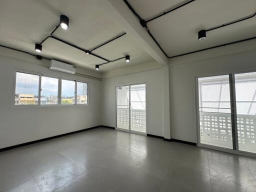 Modern living room with large windows and ample natural light