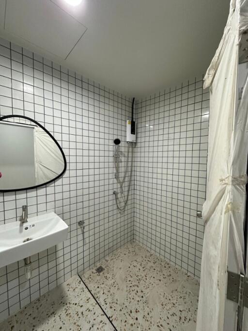 Modern bathroom with tiled walls and a sink