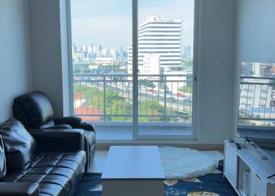 Living room with a city view and modern furniture