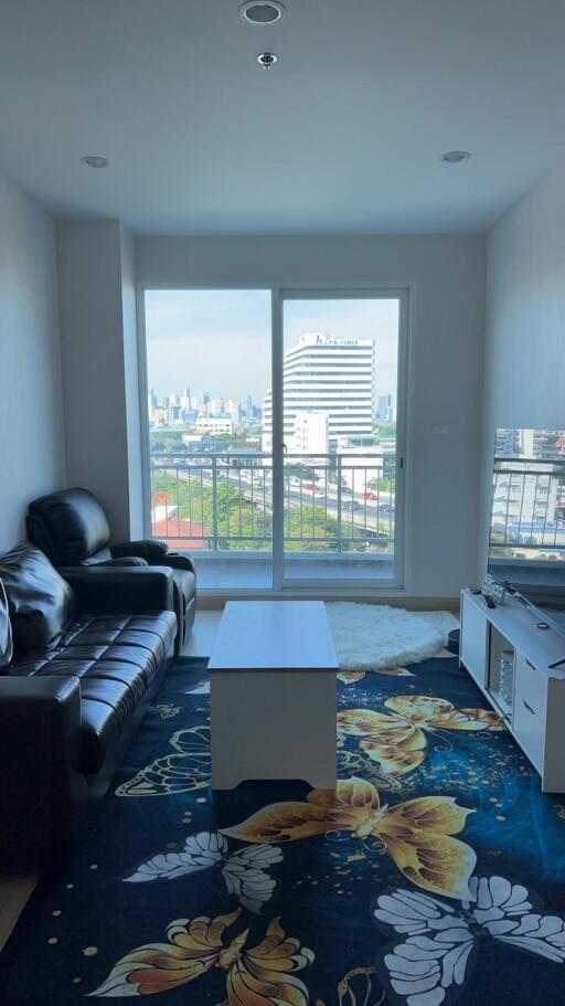 Living room with a city view and modern furniture