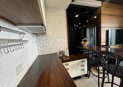 Modern kitchen area with wooden and brick design