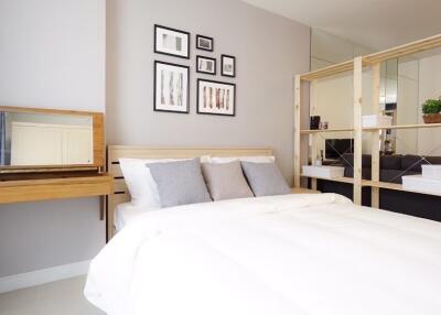 Modern bedroom with bed, nightstand, and wooden shelving