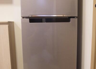 Modern refrigerator in kitchen