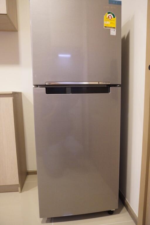 Modern refrigerator in kitchen