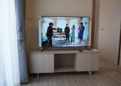 Living room with television and wooden cabinet