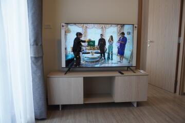 Living room with television and wooden cabinet